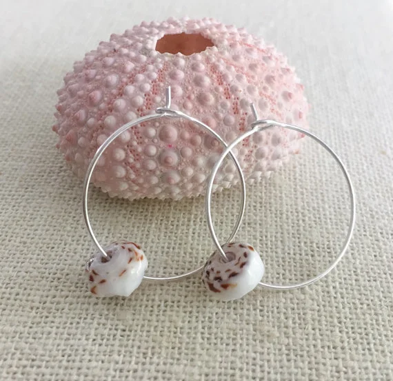 Emakai Jewerly. Puka Shell Hoop Earrings in Silver