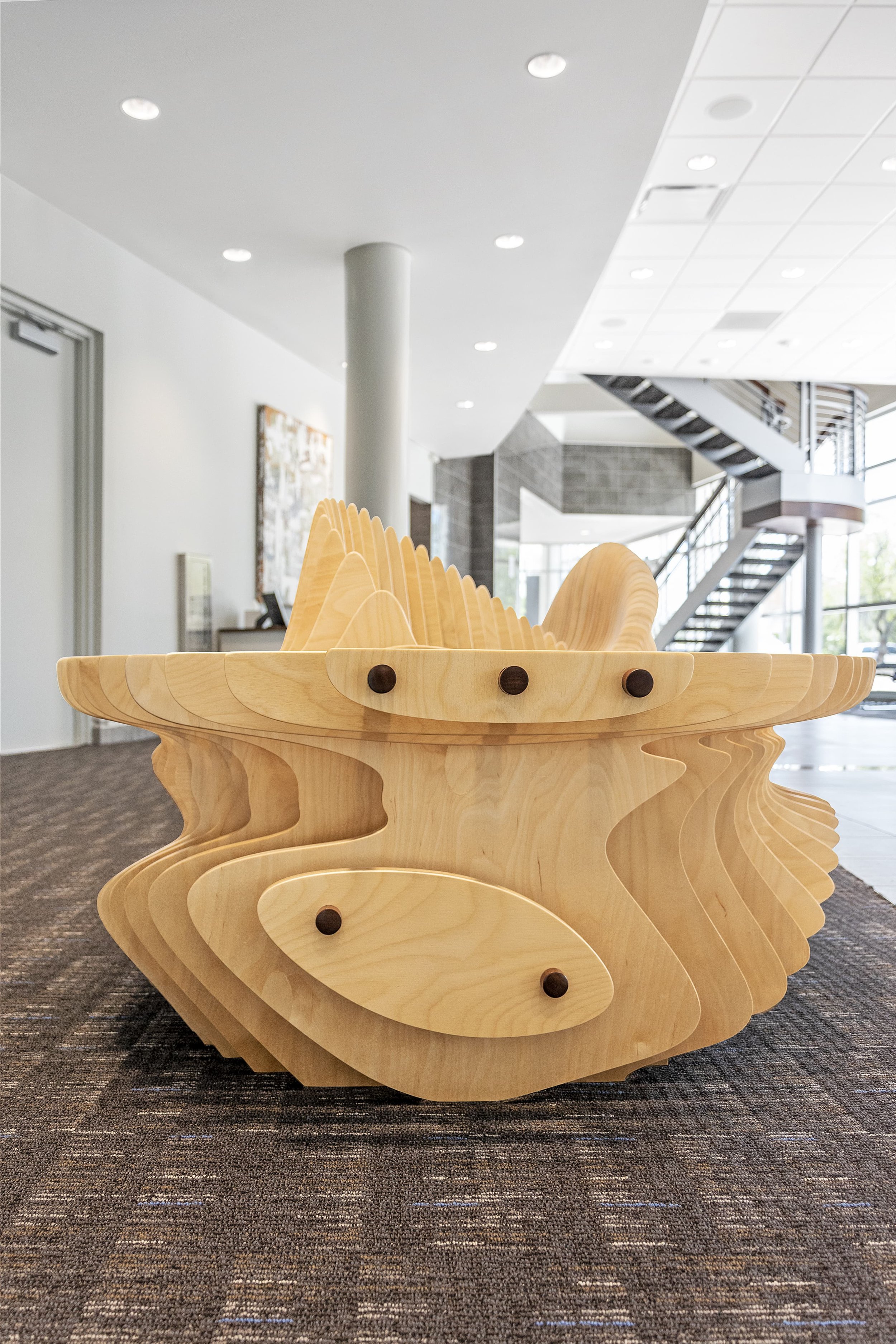 Parametric CNC Bench in Sabal Palm Bank Lobby - side view