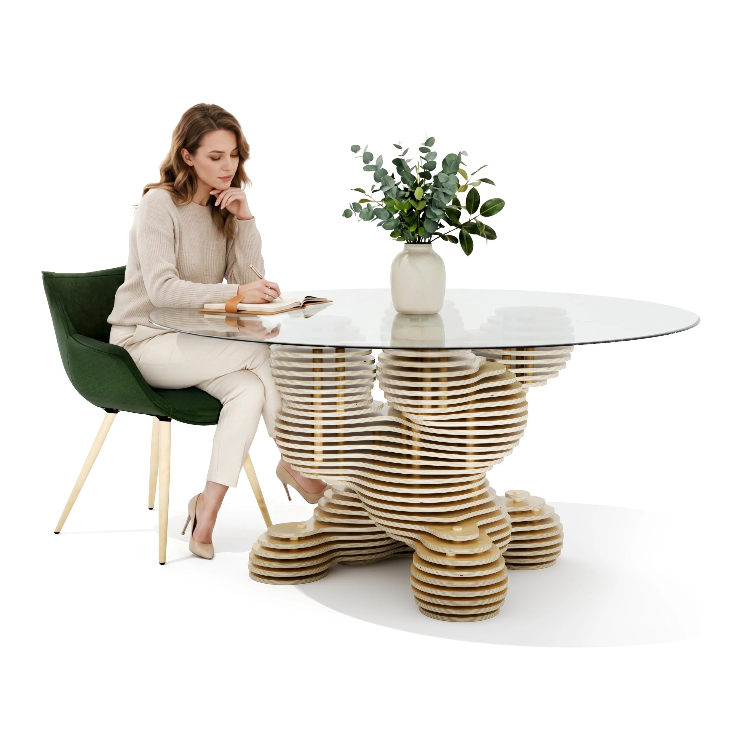 A woman sits at a modern parametric wooden table with her chin resting on her hand, writing in a notebook. There is a large potted plant with green leaves on the table. The background is white.