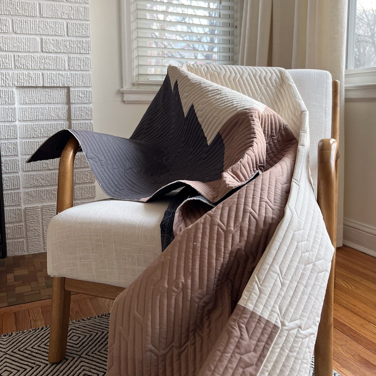 I made this Canyon quilt in 2023. I really loved the pattern writers version, and Stephs use of the Merge pantograph design. This quilt now lives in Uptown Minneapolis with two roomies, a couple plants and orange Tabby.

Maker: Me
Quilting Services: 