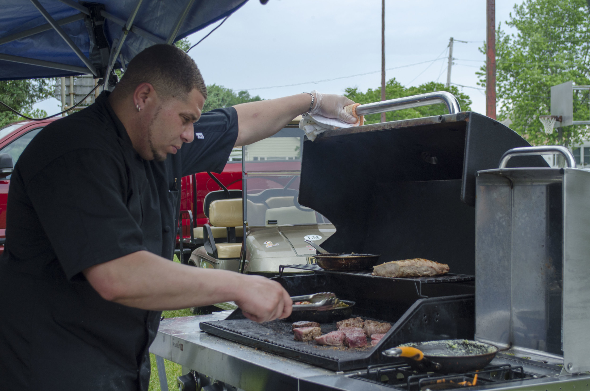 Evergreen, a restaurant located in Rochester, IN, prepares food for attendees.