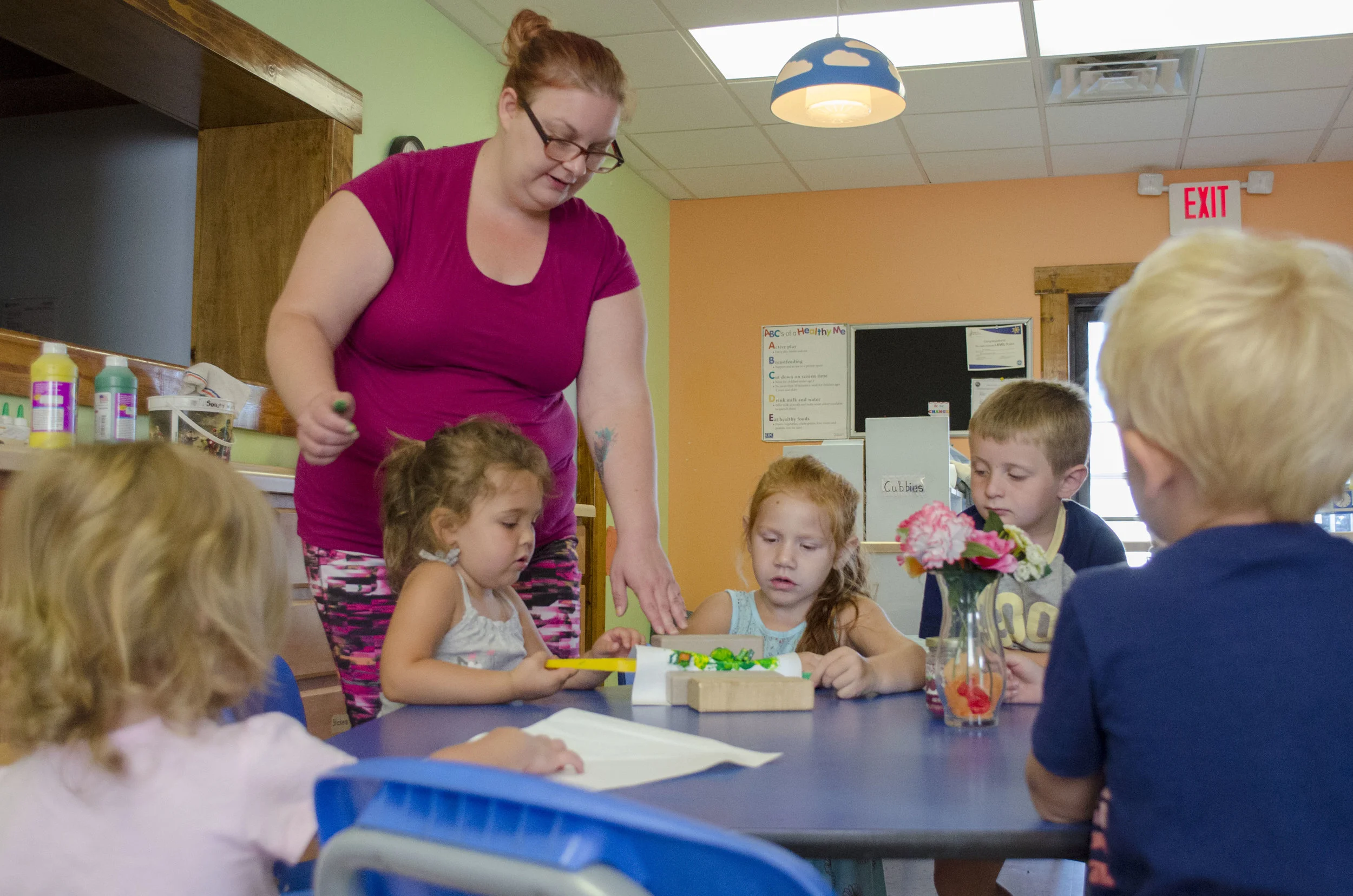 Children paint with magnets during a science activity at Max’s Playhouse. The business has been in Culver for five years.