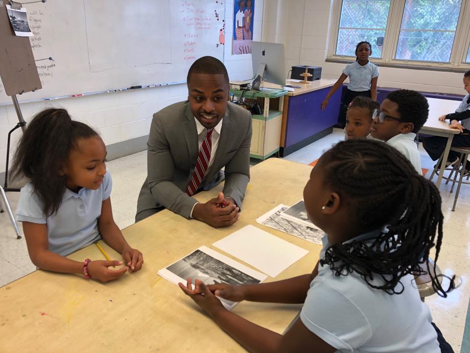 Zach with students .jpg