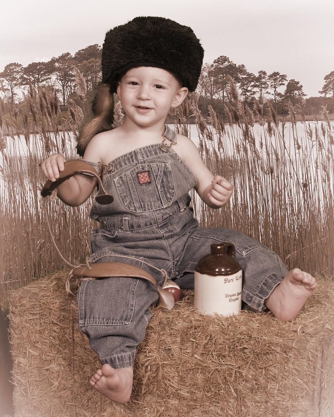 Hillbilly Porter caught a fish at our fishing hole!! Anybody wanna fry it for him? We have costumes in all sizes so come on in and see us today! #oldtimephotos #oldtimephoto #hillbilly #babyboy #fishing #greenscreen #overalls #child #costumes