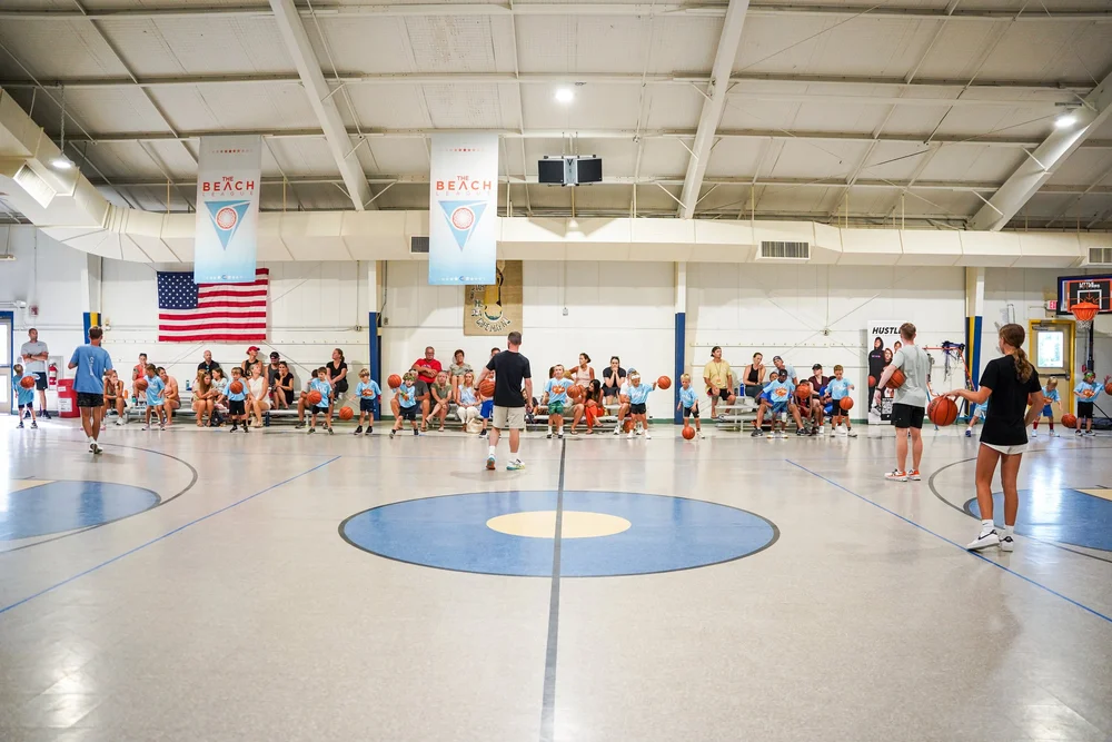 Children learning basketball skills during a Little Hoopers session