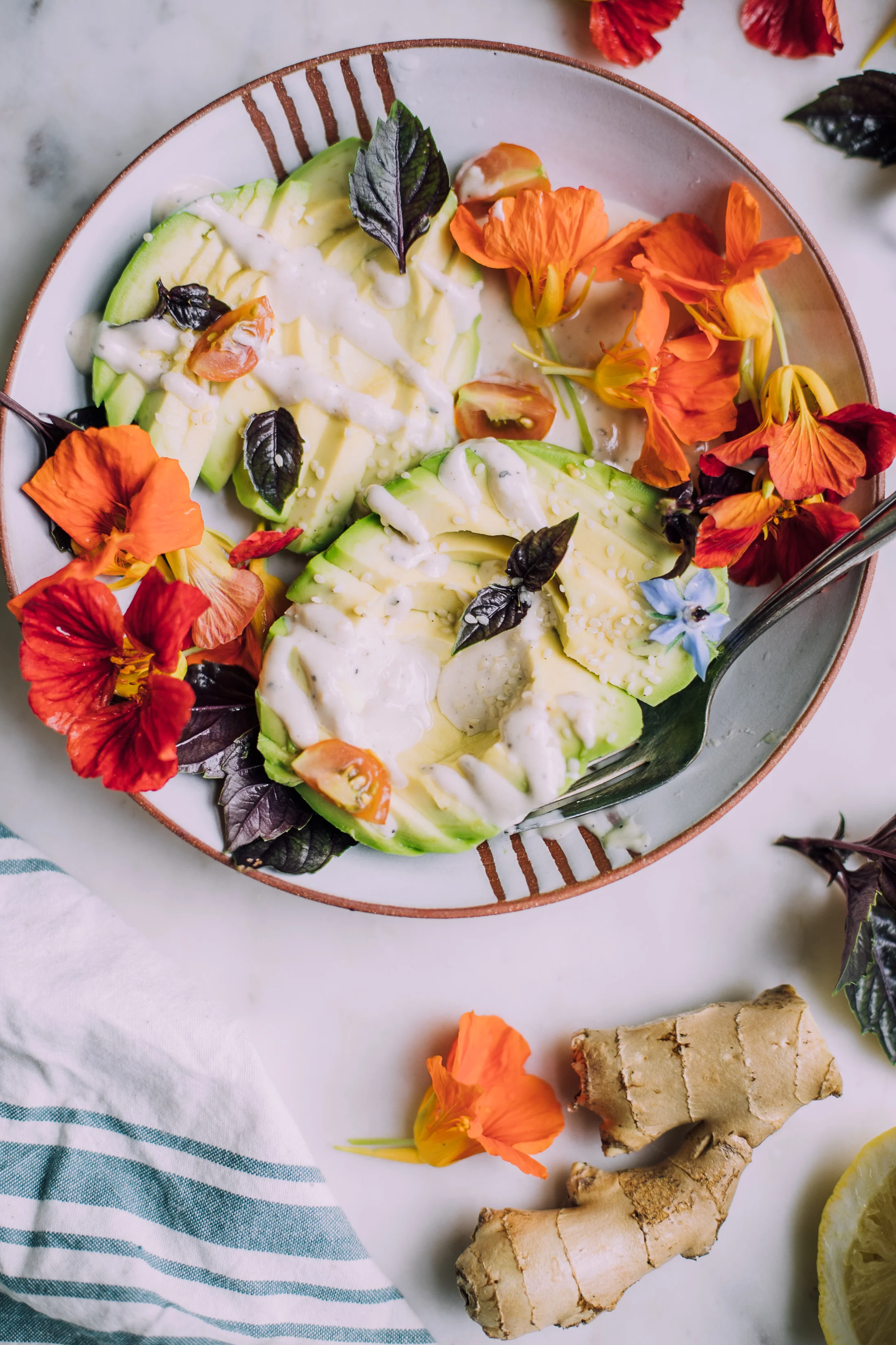 Avocado Salad with Ginger Miso Tahini Dressing and Nasturtiums