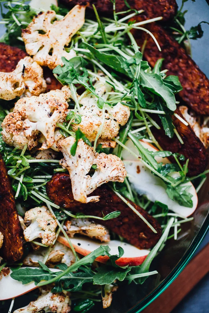 Cinnamon Roasted Cauliflower and Tempeh Bacon Salad with Sprouts & Apple