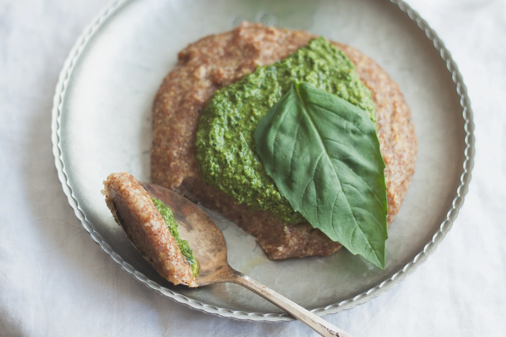 Teff & Corn Grits with Walnut Feta Pesto