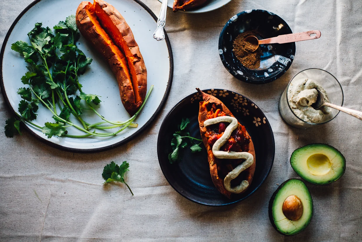 Vegan Moroccan Chili Stuffed Sweet Potatoes with Avocado Cream