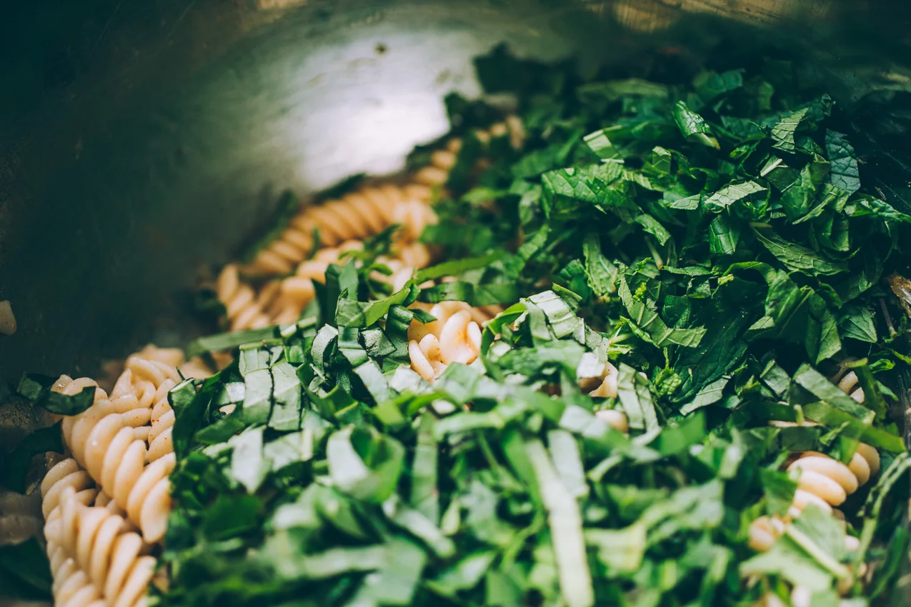 roasted farmers market pasta salad with basil, mint and pistachios