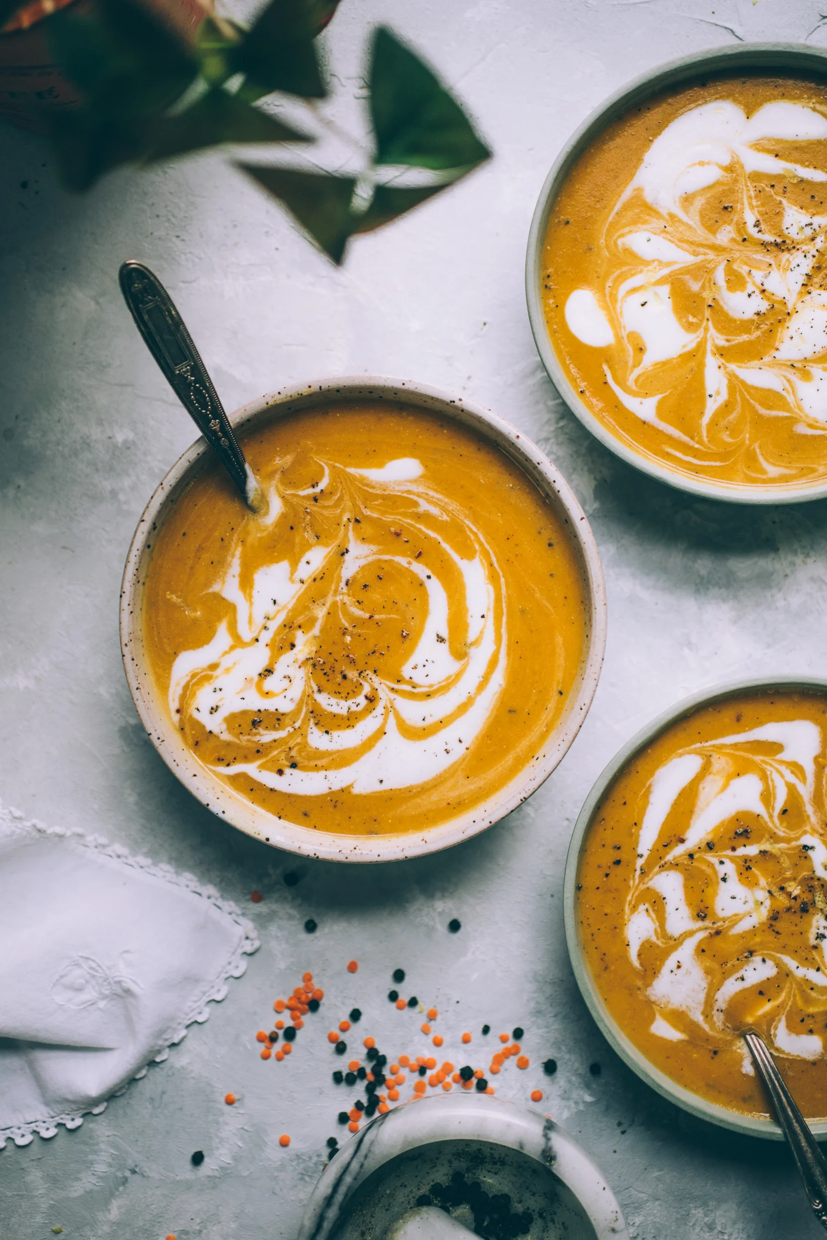 creamy curry butternut squash soup with red lentils and coconut yogurt swirl (vegan)