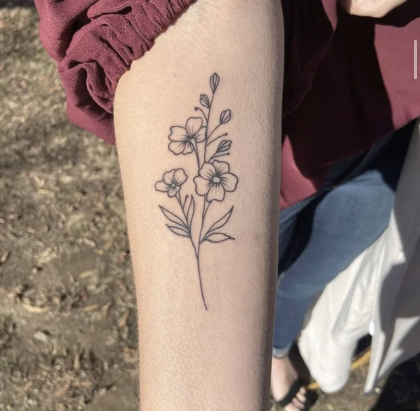 fine line flower tattoo with delicate linework