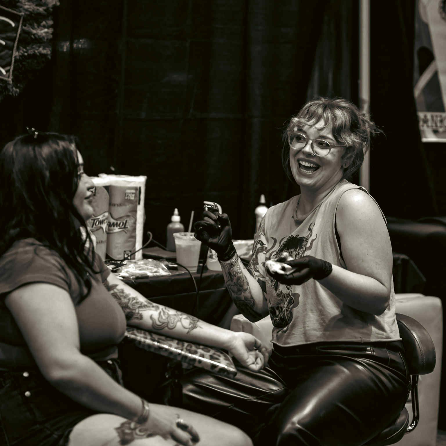 Kate Sharich creating traditional and fine line tattoos at Big Cat Tattoo in Buckhead Atlanta