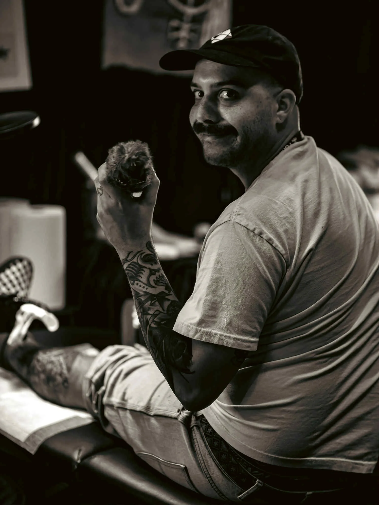 Casey Call creating bold traditional and tribal tattoo designs at Big Cat Tattoo in Buckhead Atlanta