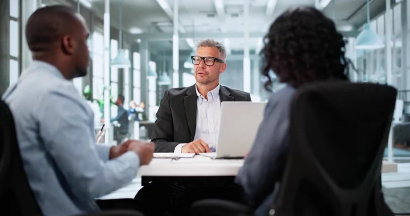 Couple meeting with advisor in an office