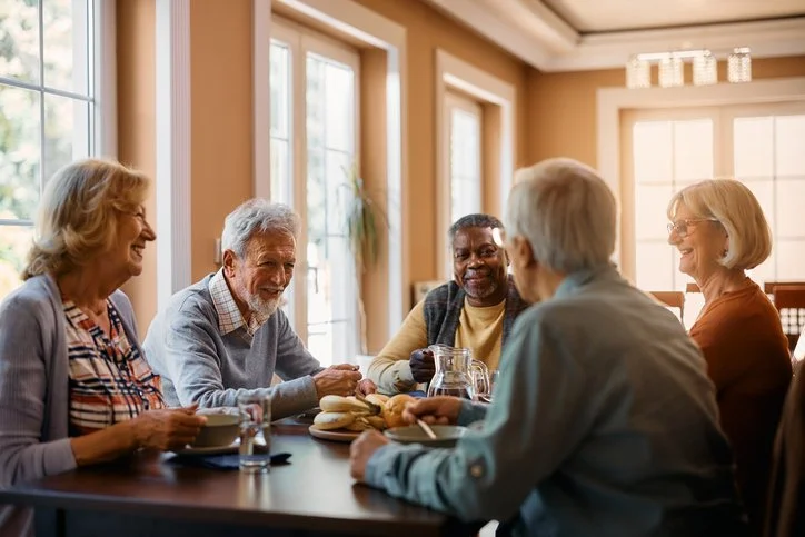 Group of senior people enjoying conversation over a meal