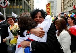 Women celebrate the signing of a historic ceasefire deal between the Colombian government and FARC rebels in Bogota, Colombia, on June 23, 2016. (John Vizcaino/Reuters)