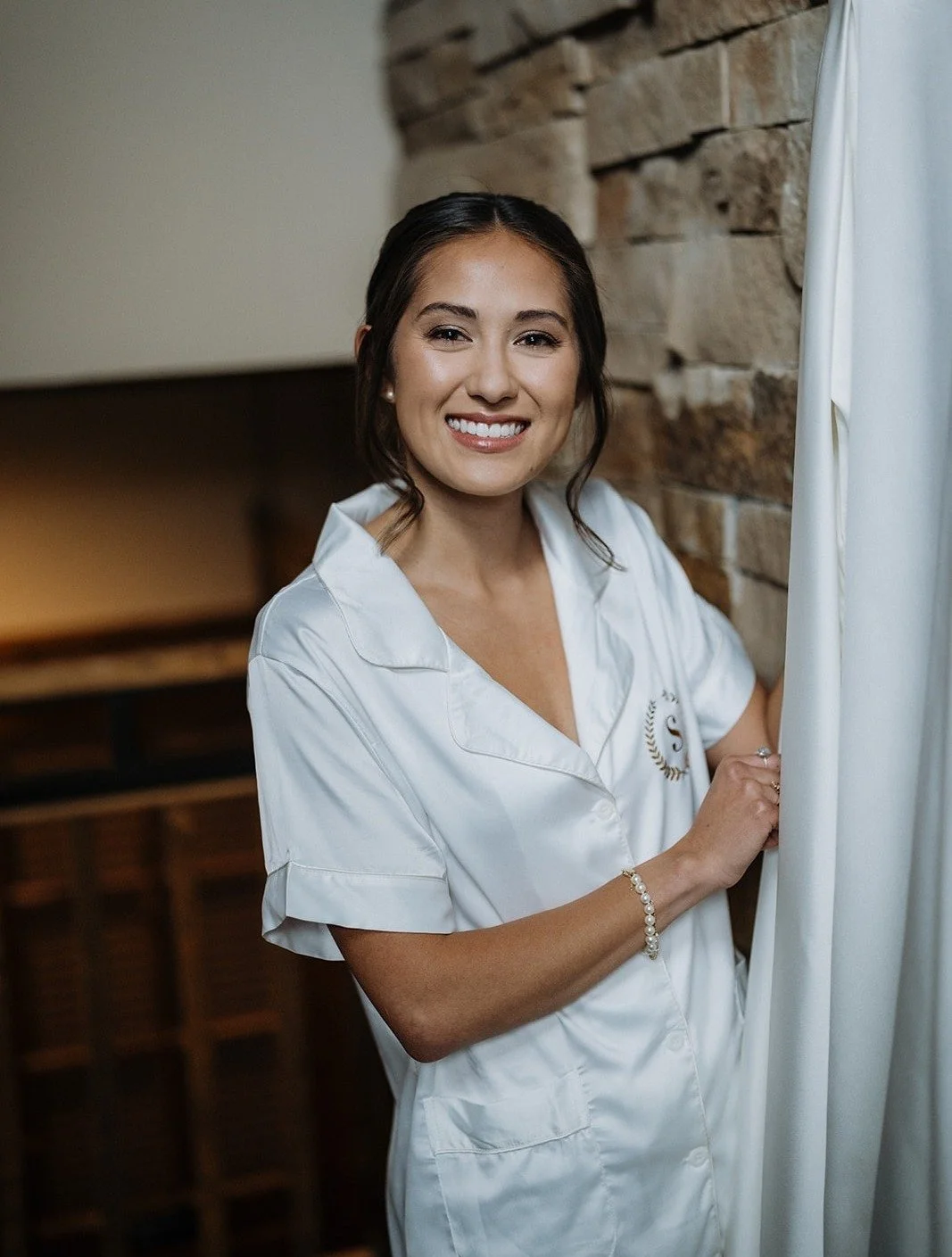 From robe to aisle, we&rsquo;re here for every part of your beauty journey. This look was all about soft elegance: a clean low bun, delicate detail around the eyes, and skin that looked like it was lit from within. Getting our bride ready was pure jo