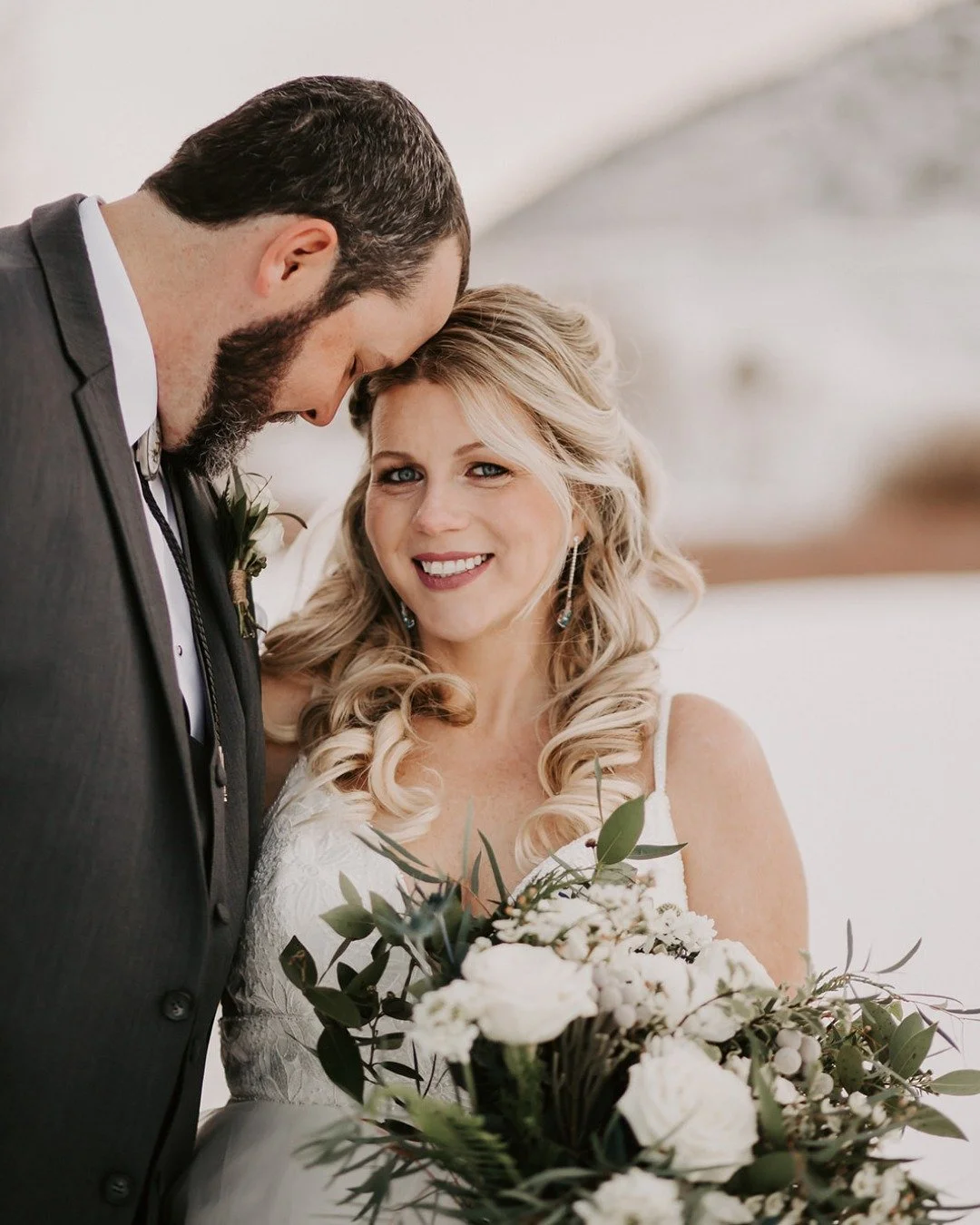 She brought the beauty and the joy. With fresh, glowing skin and soft flowing curls, our bride lit up this snowy day in the most timeless way. 💖

Let&rsquo;s talk about creating your perfect winter wedding look.

Photographer: @mecheausinaphotograph