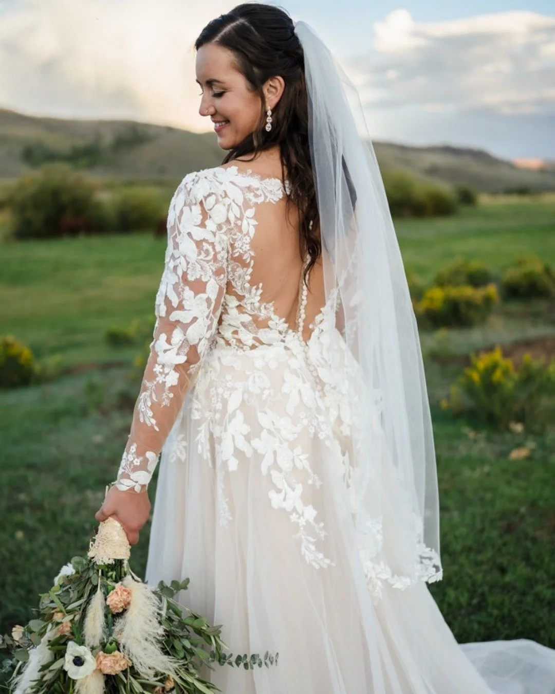 Our bride&rsquo;s look was soft and simple, with a half-up wave that held all day and natural makeup that gave her the perfect glow. It all came together so effortlessly. 🤍

Venue: @clazyuranch
Photo: @kandbphotos_
Floral: @petalscolorado
Music: @tr