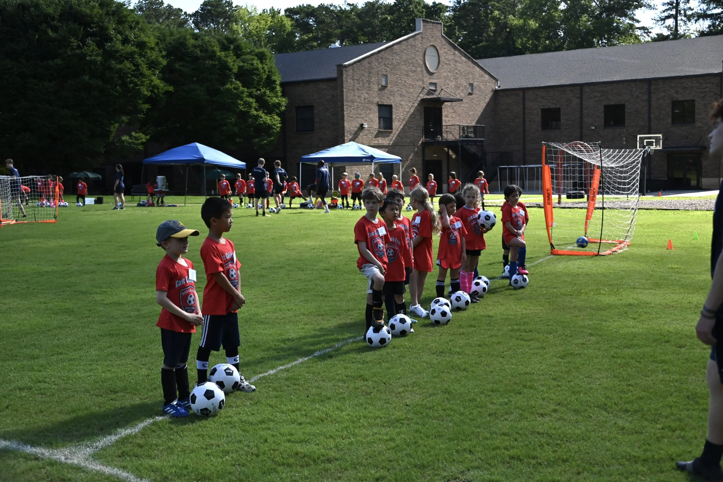 kids lined up with ball.jpeg