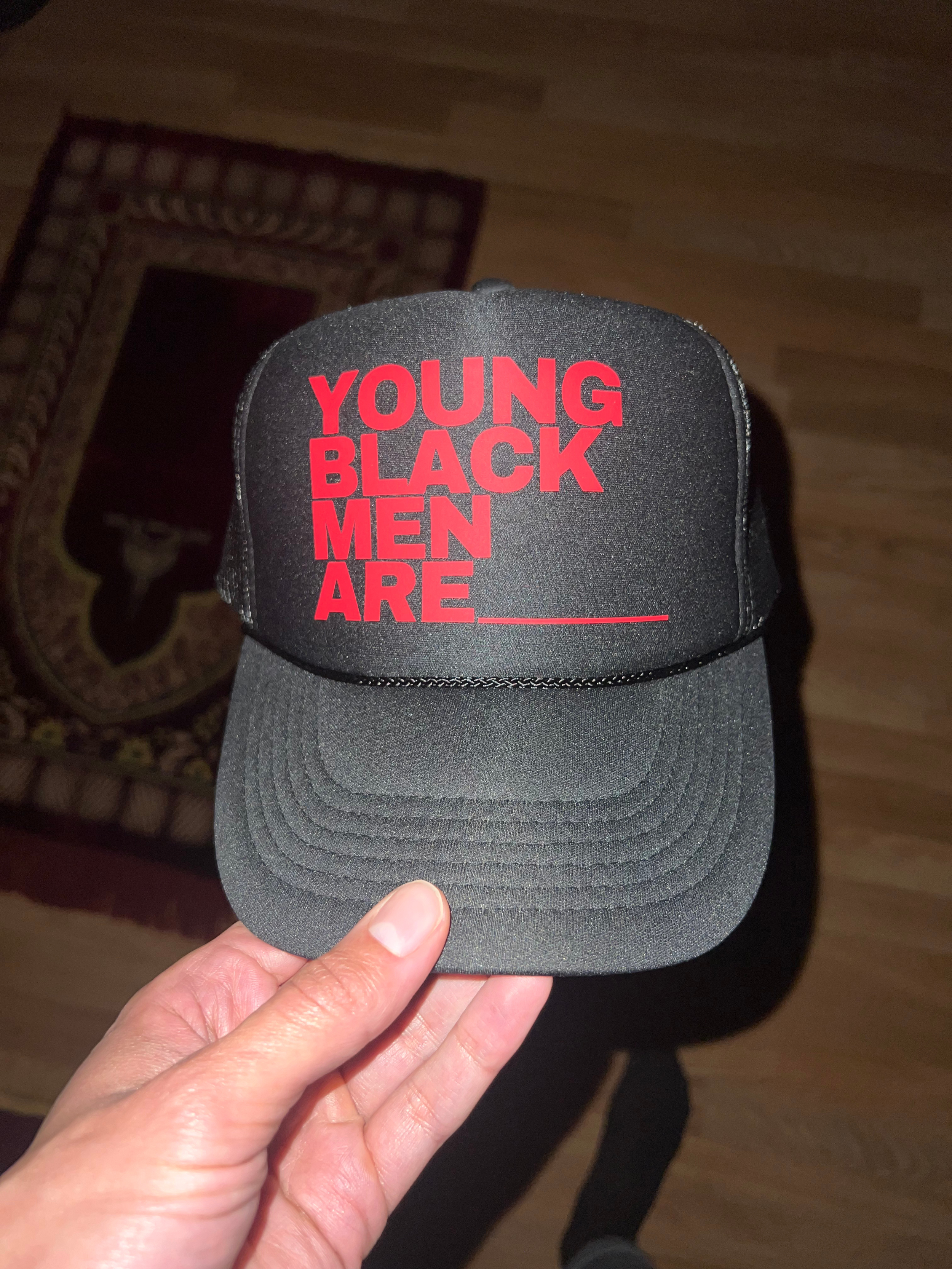 Young Black Men Are_____ Trucker Hat - Black