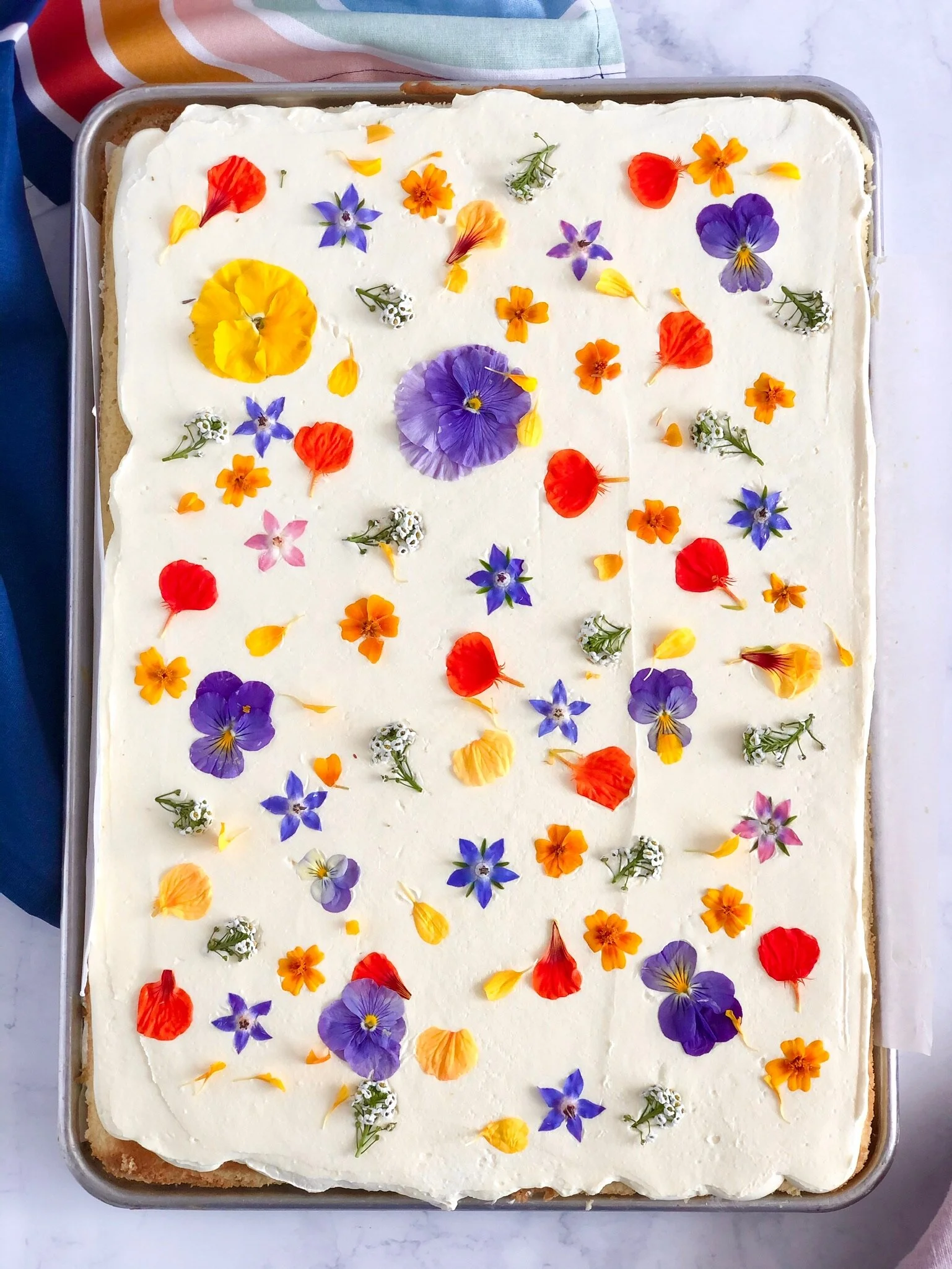 Our sheet cake which is 2 layers of cake with complementary buttercream, in our signature styles.