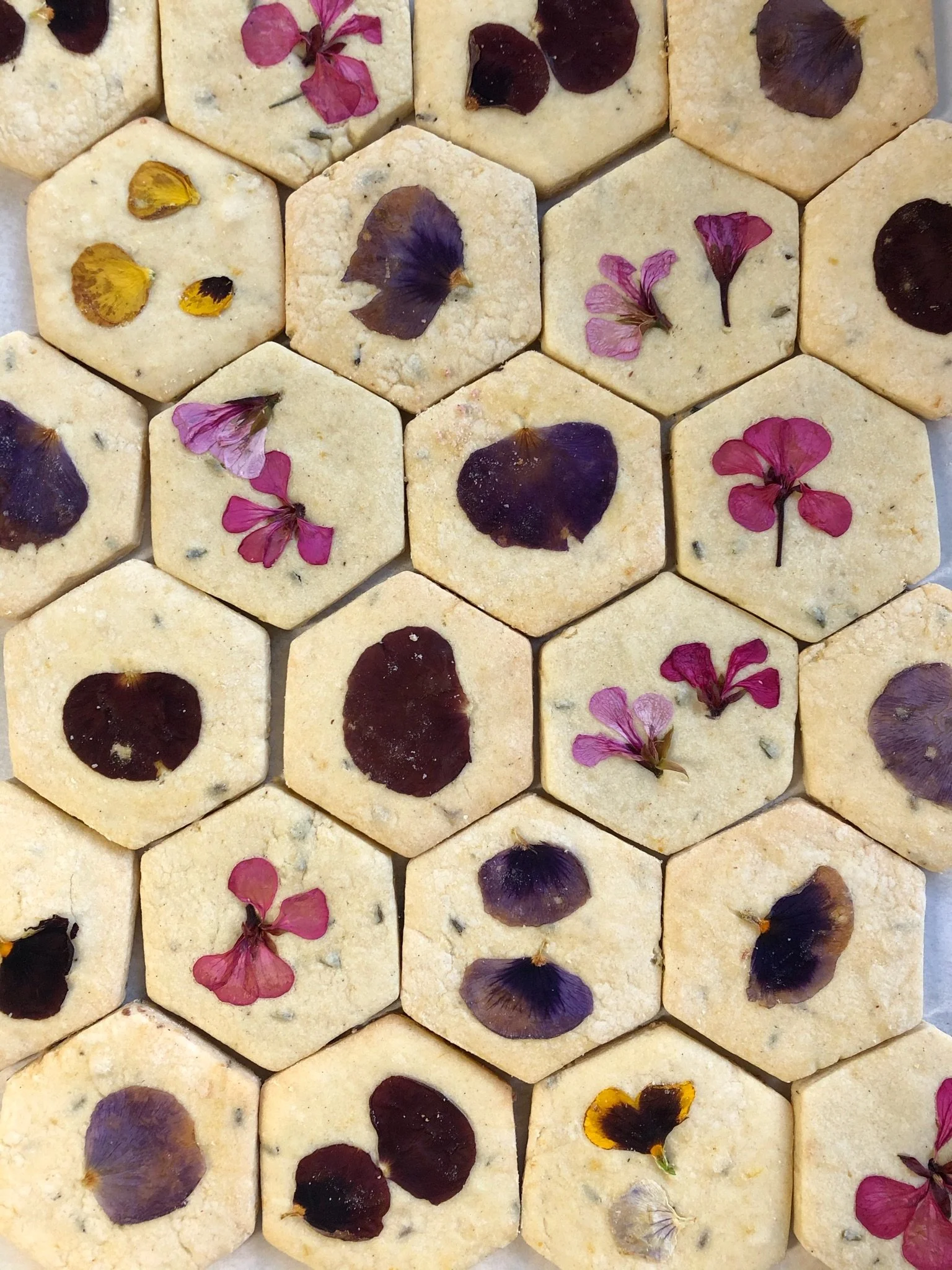 Buttery shortbread cookies flavored with seasonal citrus zest and pressed with local farm fresh edible blooms