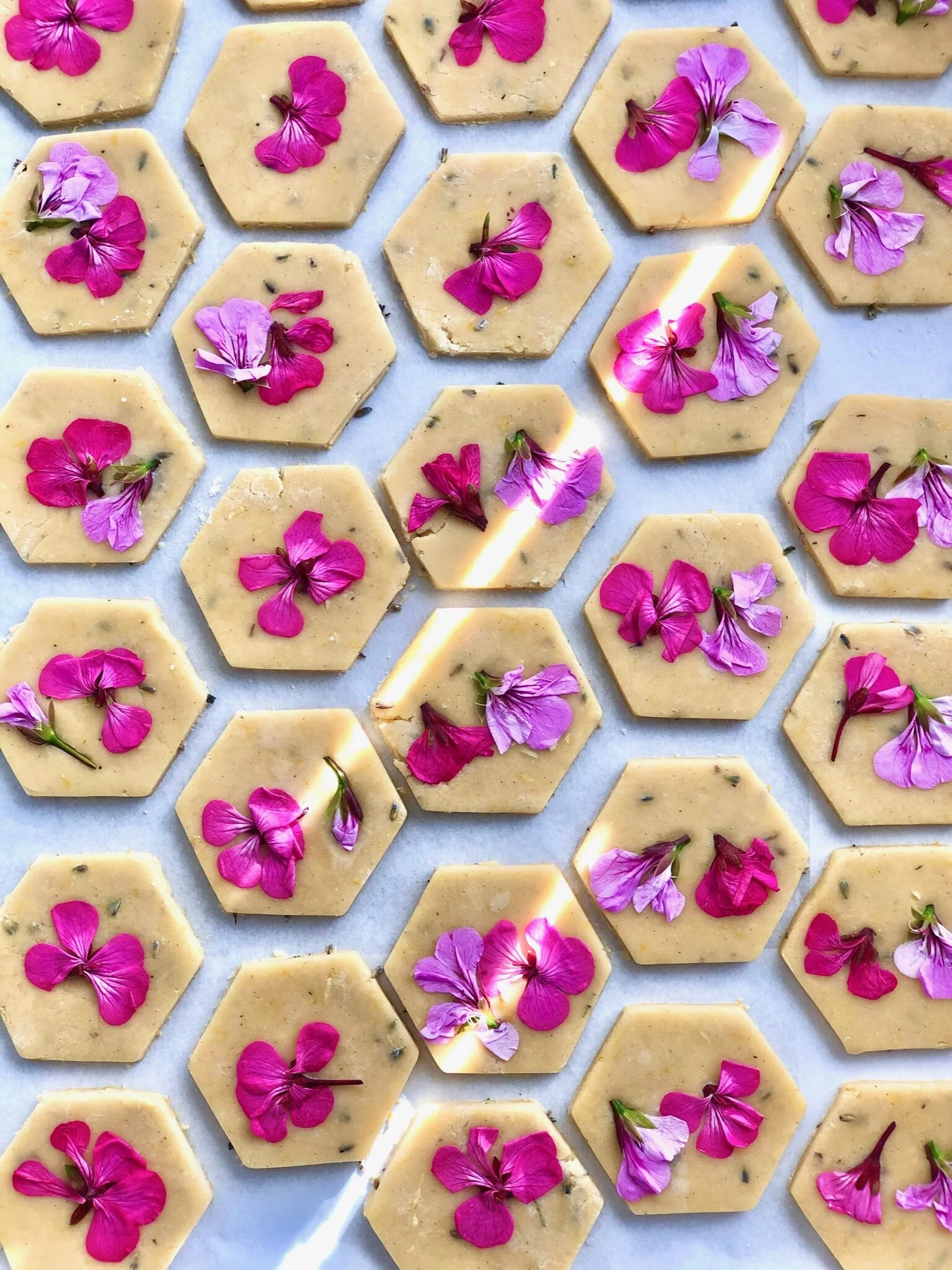 Buttery shortbread cookies flavored with seasonal citrus zest and pressed with local farm fresh edible blooms