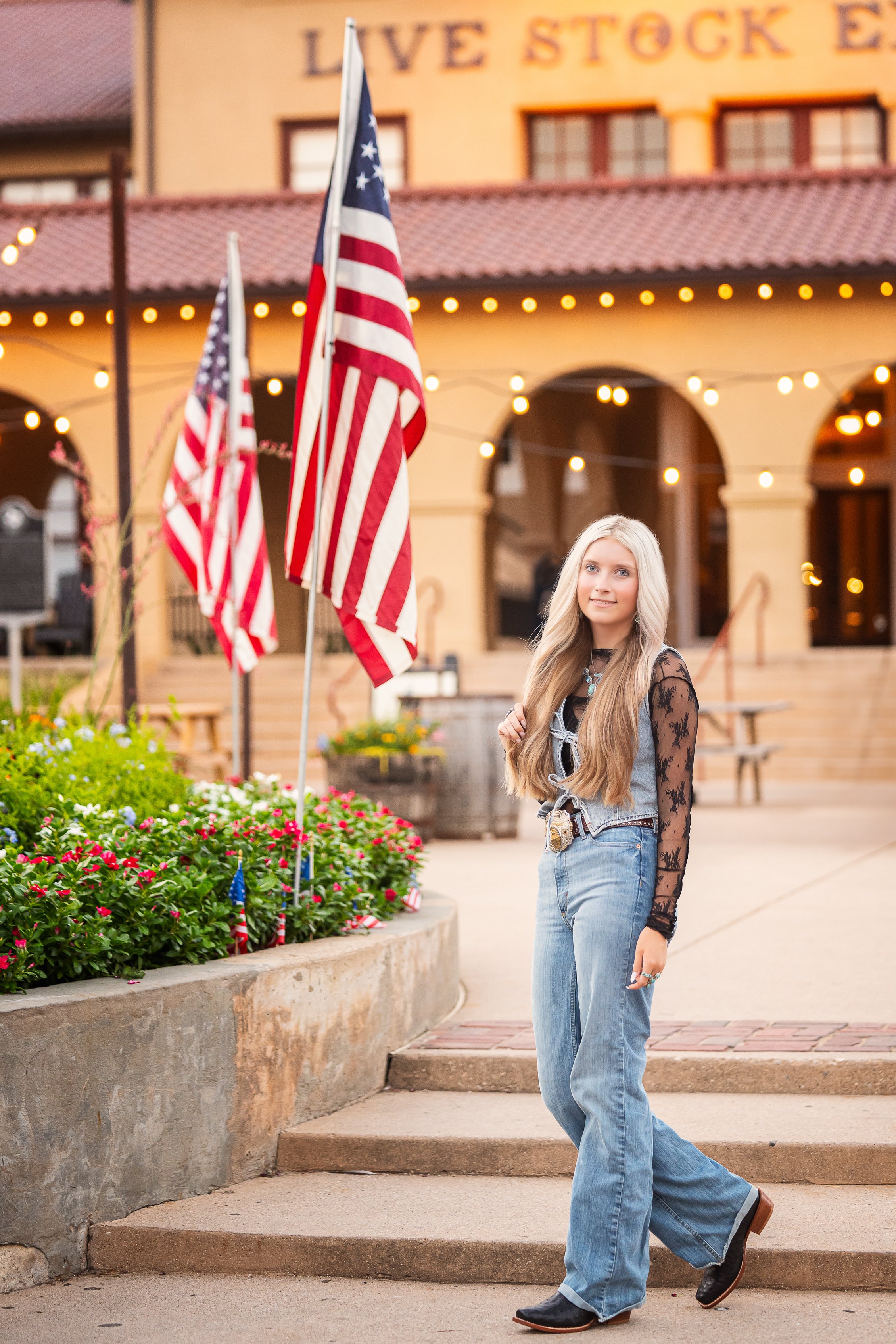 Fort Worth Stockyards senior photographer capturing senior portrait near the Live Stock Exchange