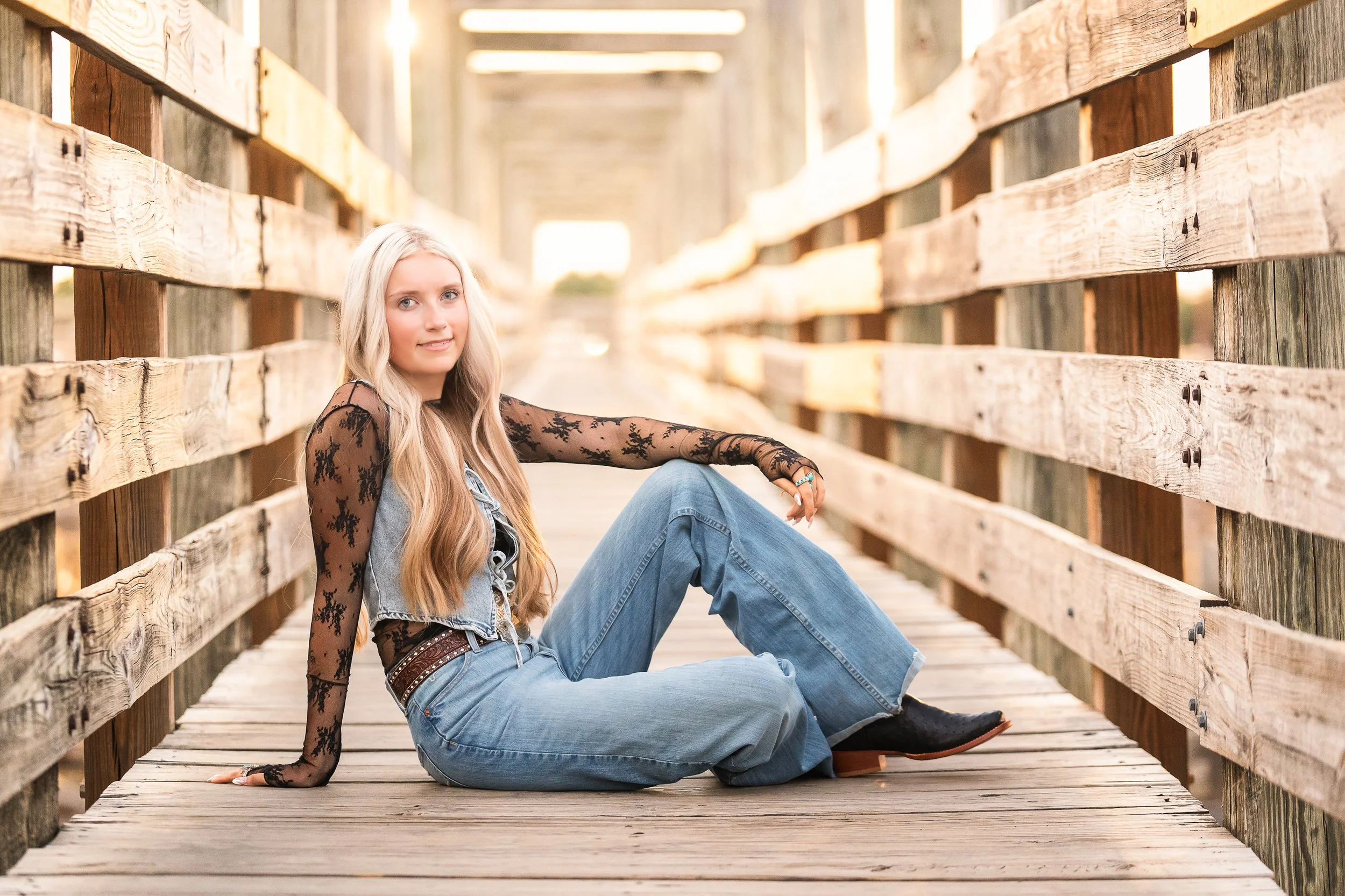 Fort Worth Stockyards senior pictures with rustic Western backdrop
