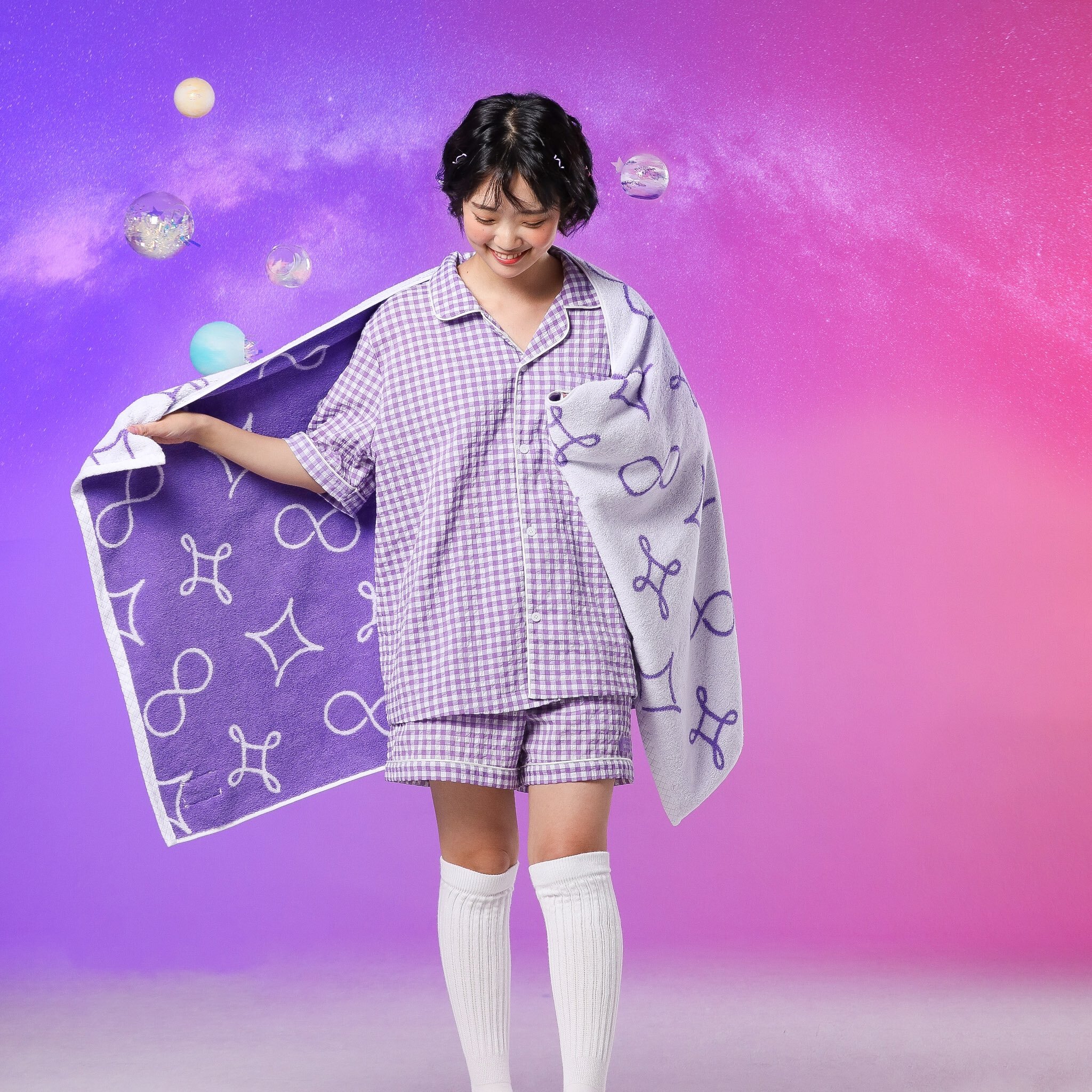 SOWOOZOO purple pajama short set with the white beach towel