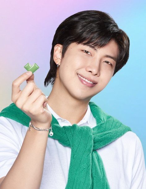 RM poses holding with BTS Xylitol gum