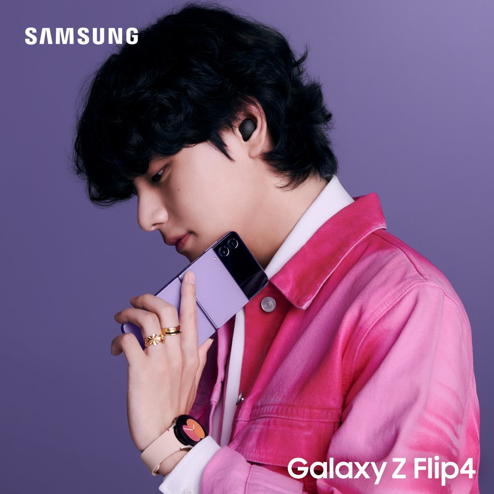 V wearing the new Galaxy Watch 5 and Buds 2 Pro while holding the new Z Flip4