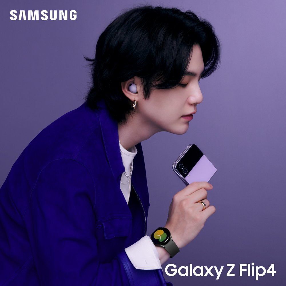 RM wearing the new Galaxy Watch 5 and Buds 2 Pro while holding the new Z Flip4