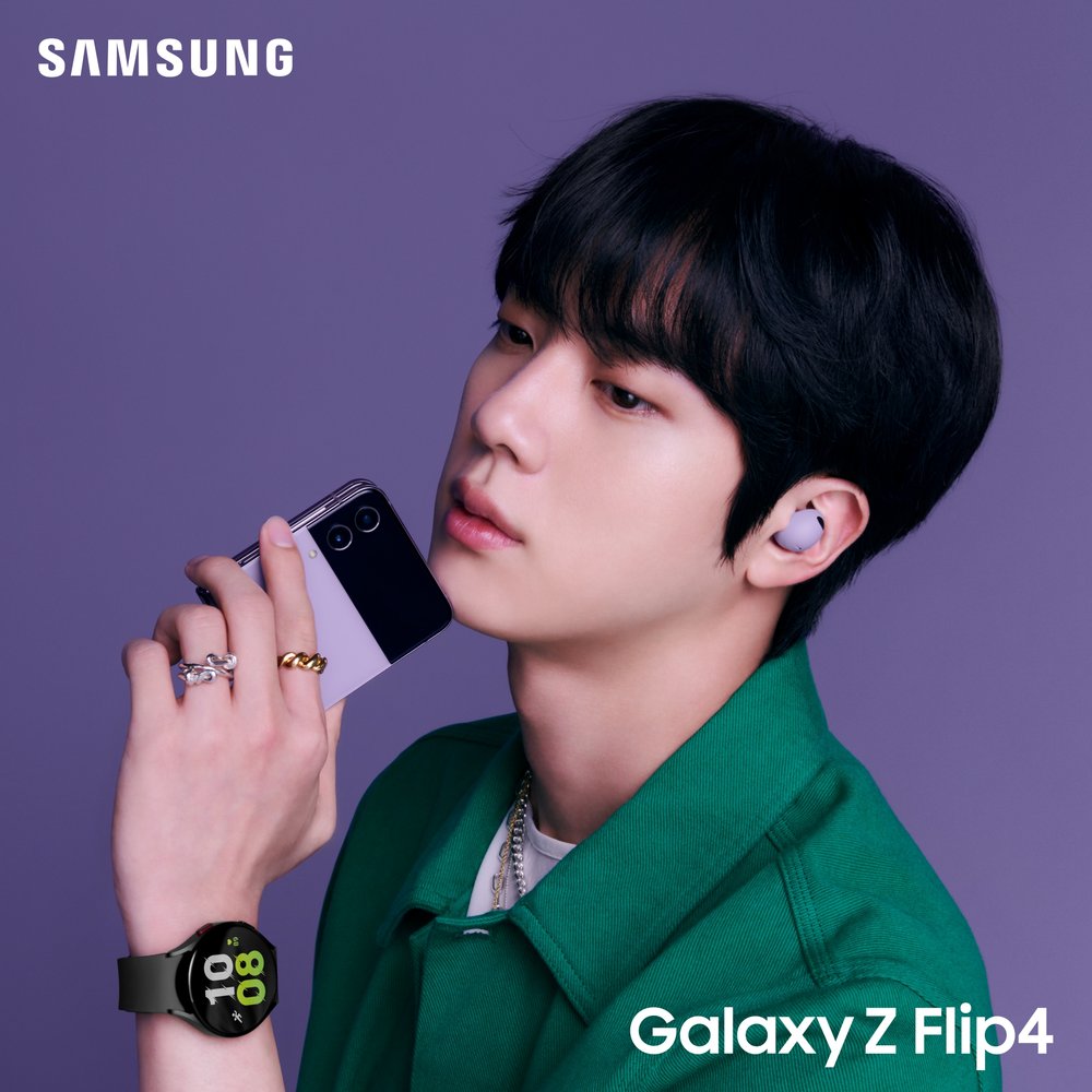 Jin wearing the new Galaxy Watch 5 and Buds 2 Pro while holding the new Z Flip4