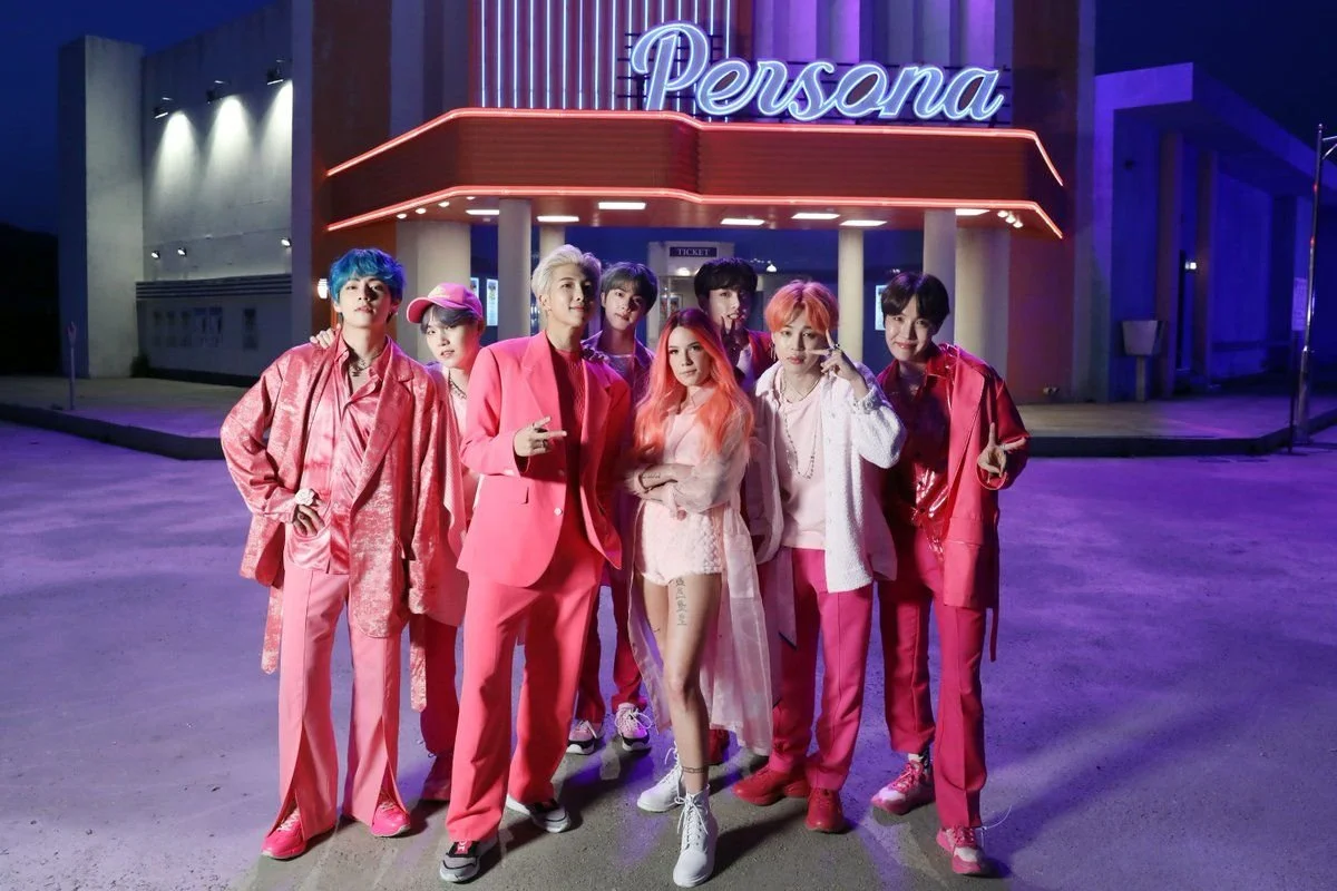 BTS and Halsey on the set of the "Boy With LUV" music video shoot, wearing pink outfits