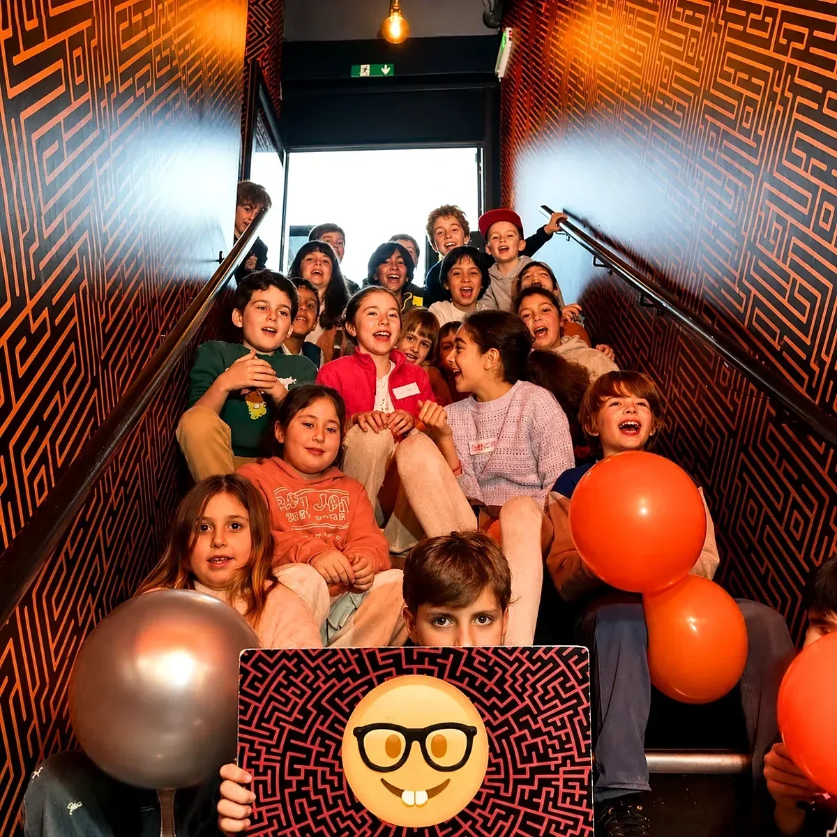 Students celebrating during an Escape London school trip escape room experience in London