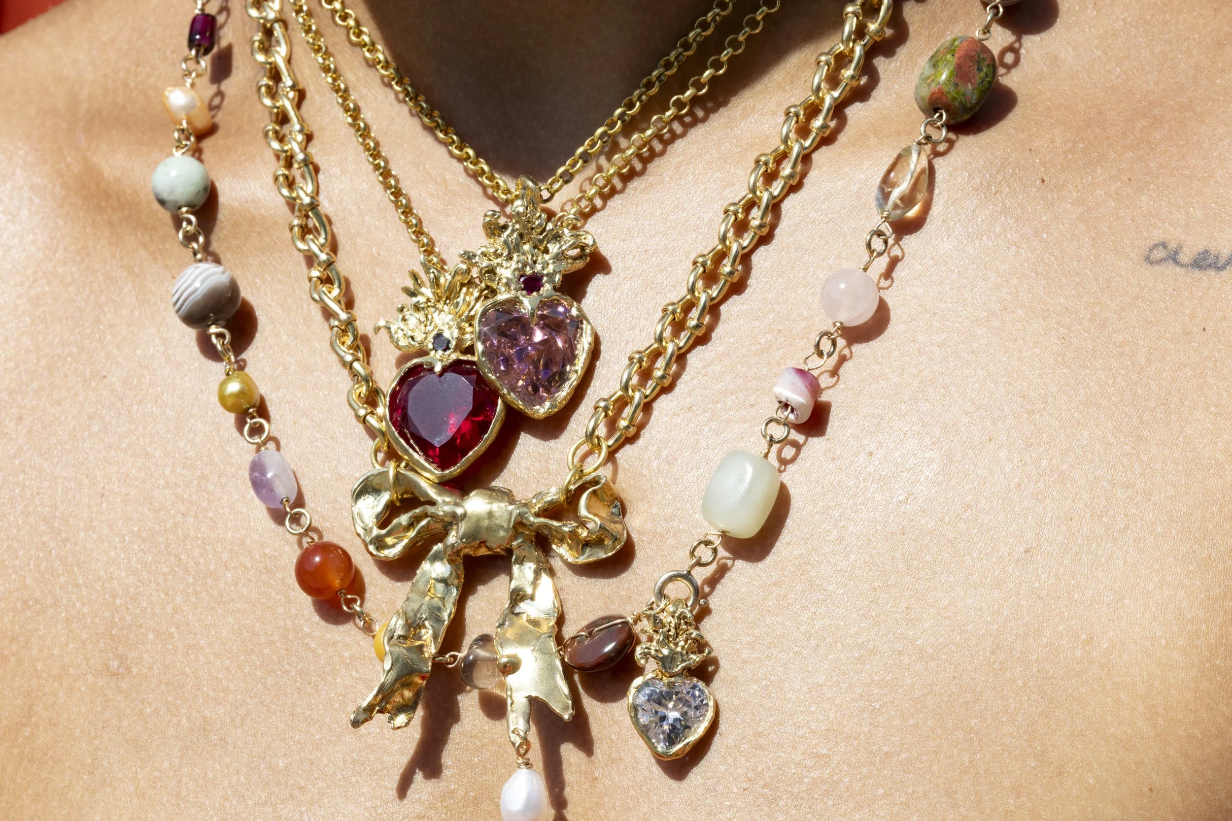 Layered pink charms and red rings-14.jpg