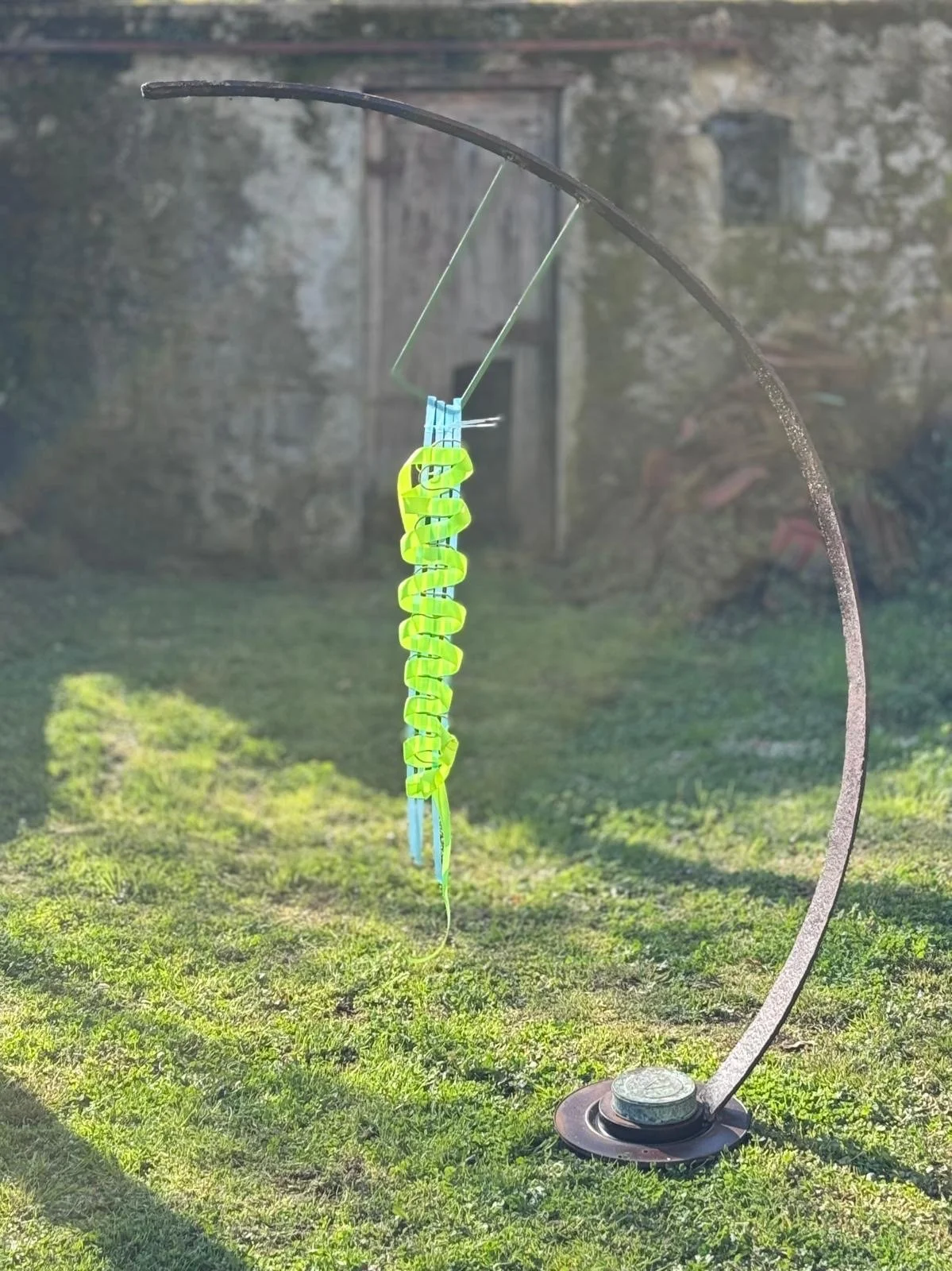   I Find Myself Here I Find Myself, 2026   Sculpture: Vintage steel agricultural and car parts, salvaged aluminium bars, gilding and acrylic paint.  Weaving: Reclaimed supermarket packaging, electrical wire, neon webbing straps  1.95m high × 10cm wid