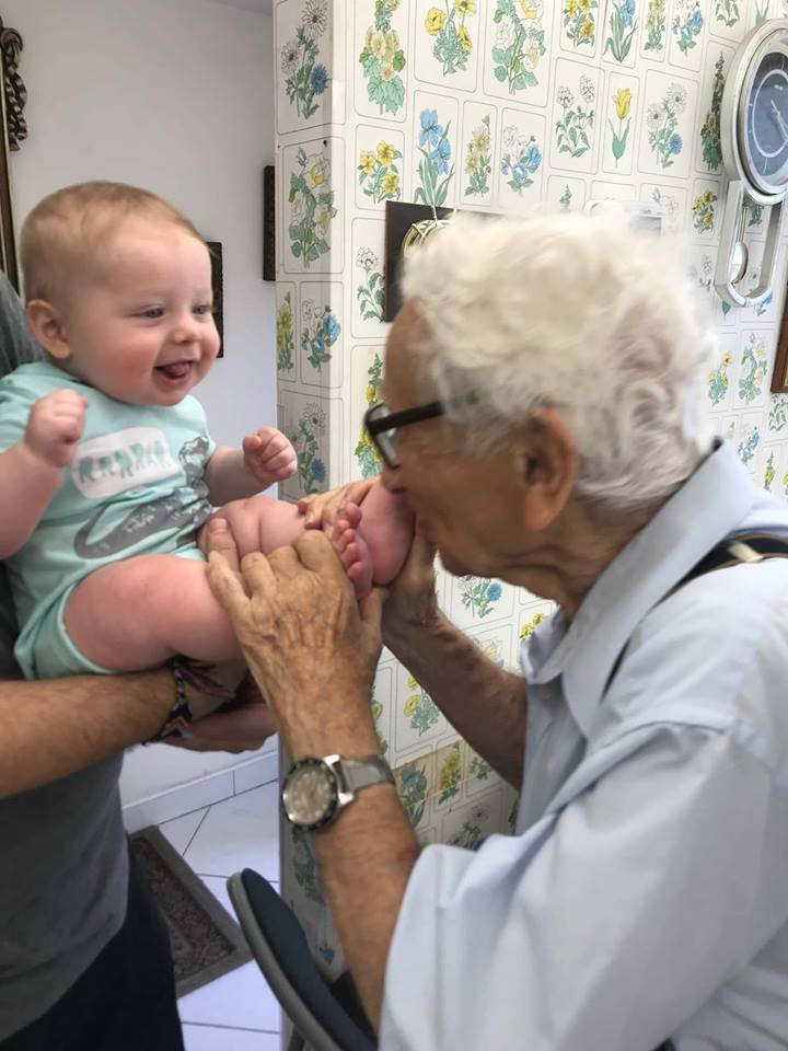 Benny meeting his great grandson Rex. “Our children and grandchildren and great grandchildren are how we know we survived.”