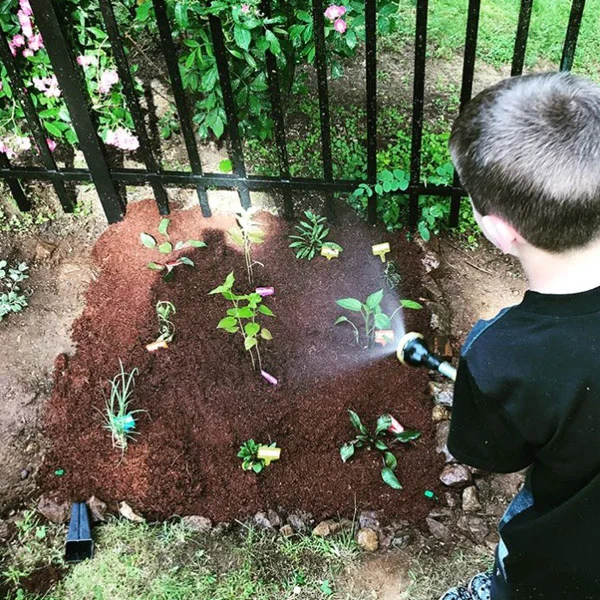PlantedGardenKidWatering.jpg