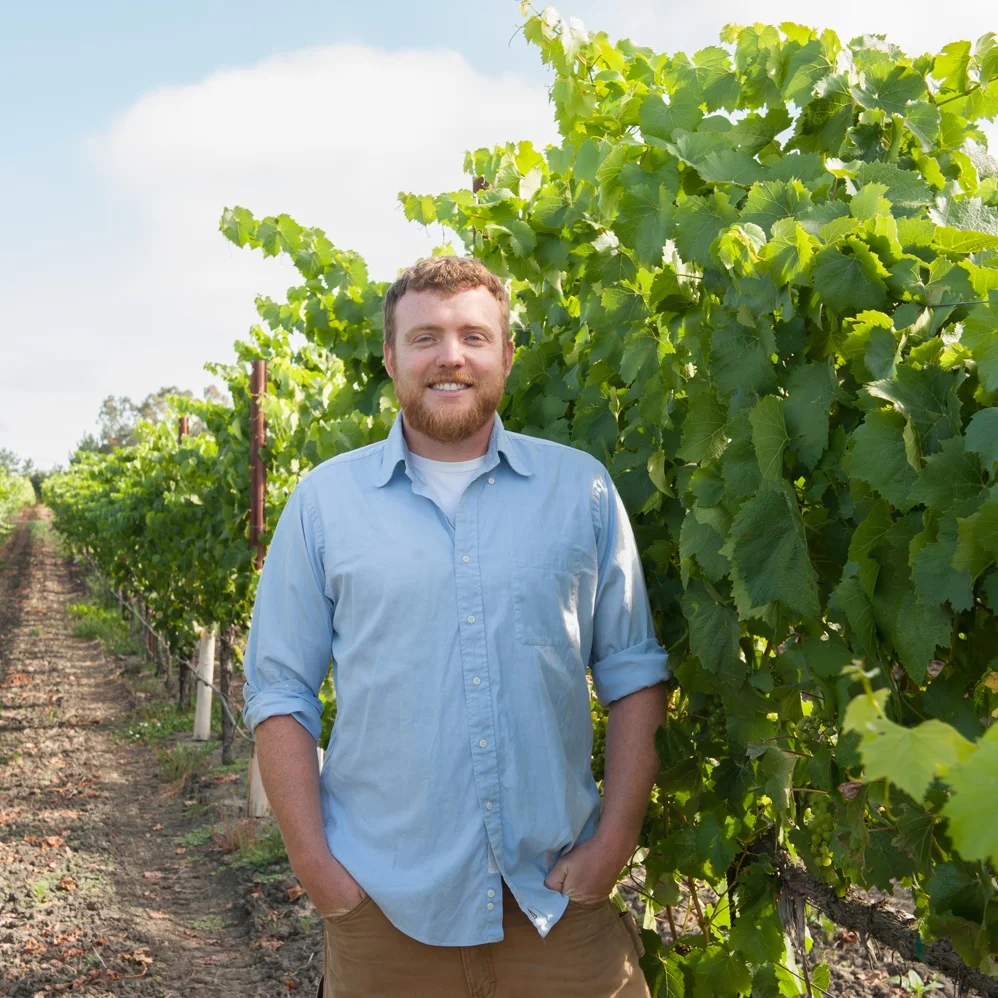 Associate_winemaker_Ian_posing_in_vineyards.jpg