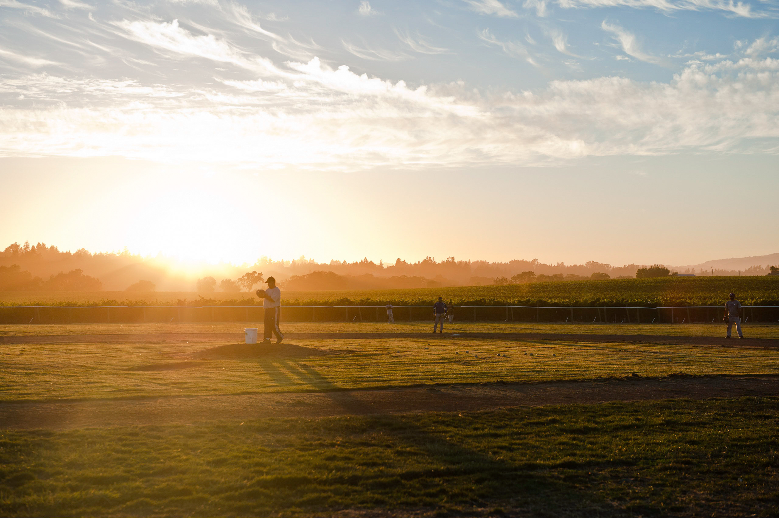 Sunset_image_of_people_playing_on_the_field_of_dreams.png