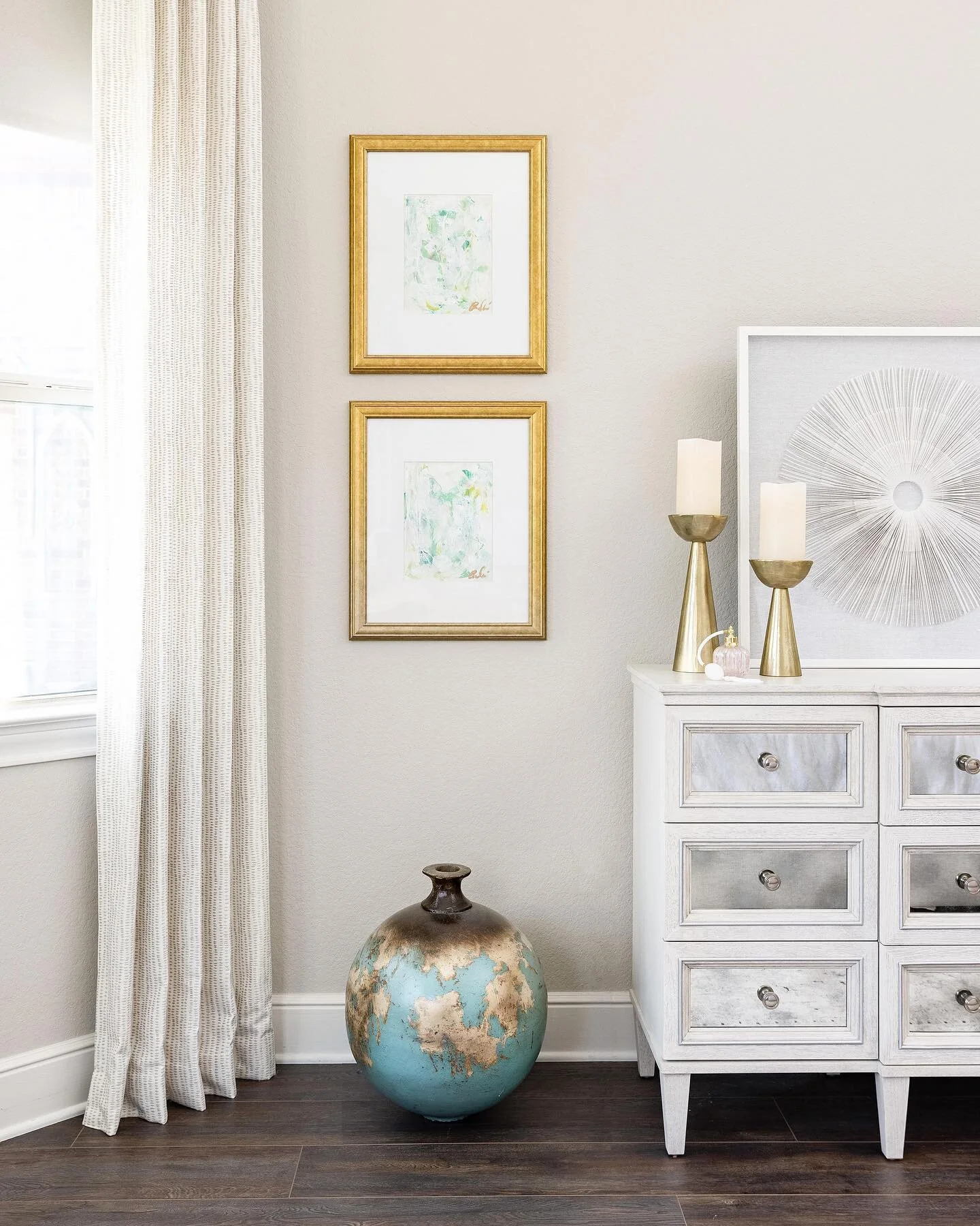 Every room needs a starting point. In the case of this primary bedroom, the client had this large vase that was used with her old decor. 
She still liked it but was unsure of how it could tie in. We used it as the color inspo for the blue-green thro
