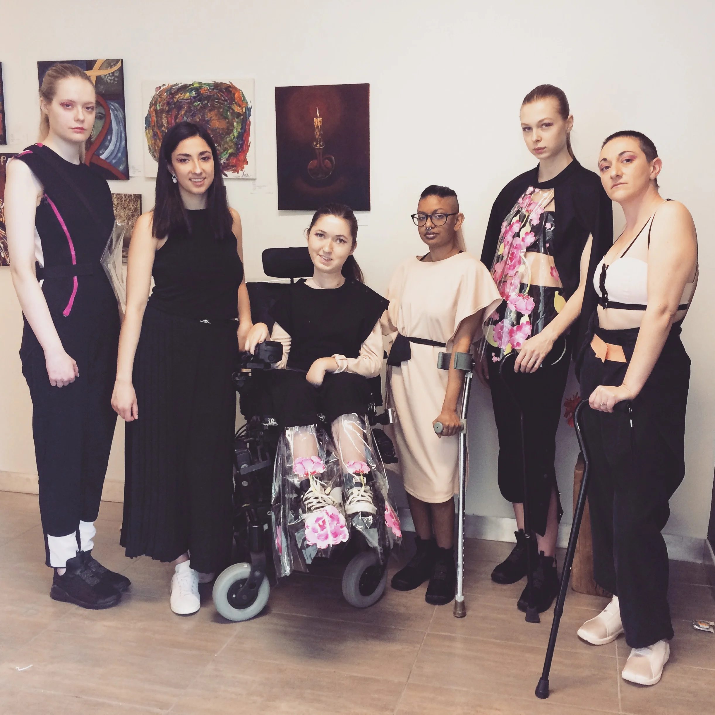 From Left: BRYANNA ELKINS, SONIA PRANCHO, TORI LACEY, MARI RAMSAWAKH, RACHEL ROMU and LOTTIE LAWRENCE MOODY, photographer: MEG POWER Wearing UN•FORM backstage #letsmakerunwayaccessible Ryerson’s MASS EXODUS 2018