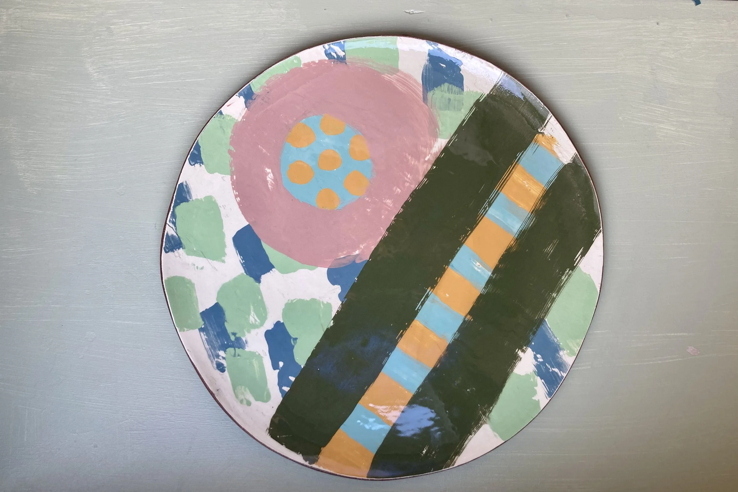 Students finished mono printed large terracotta plate