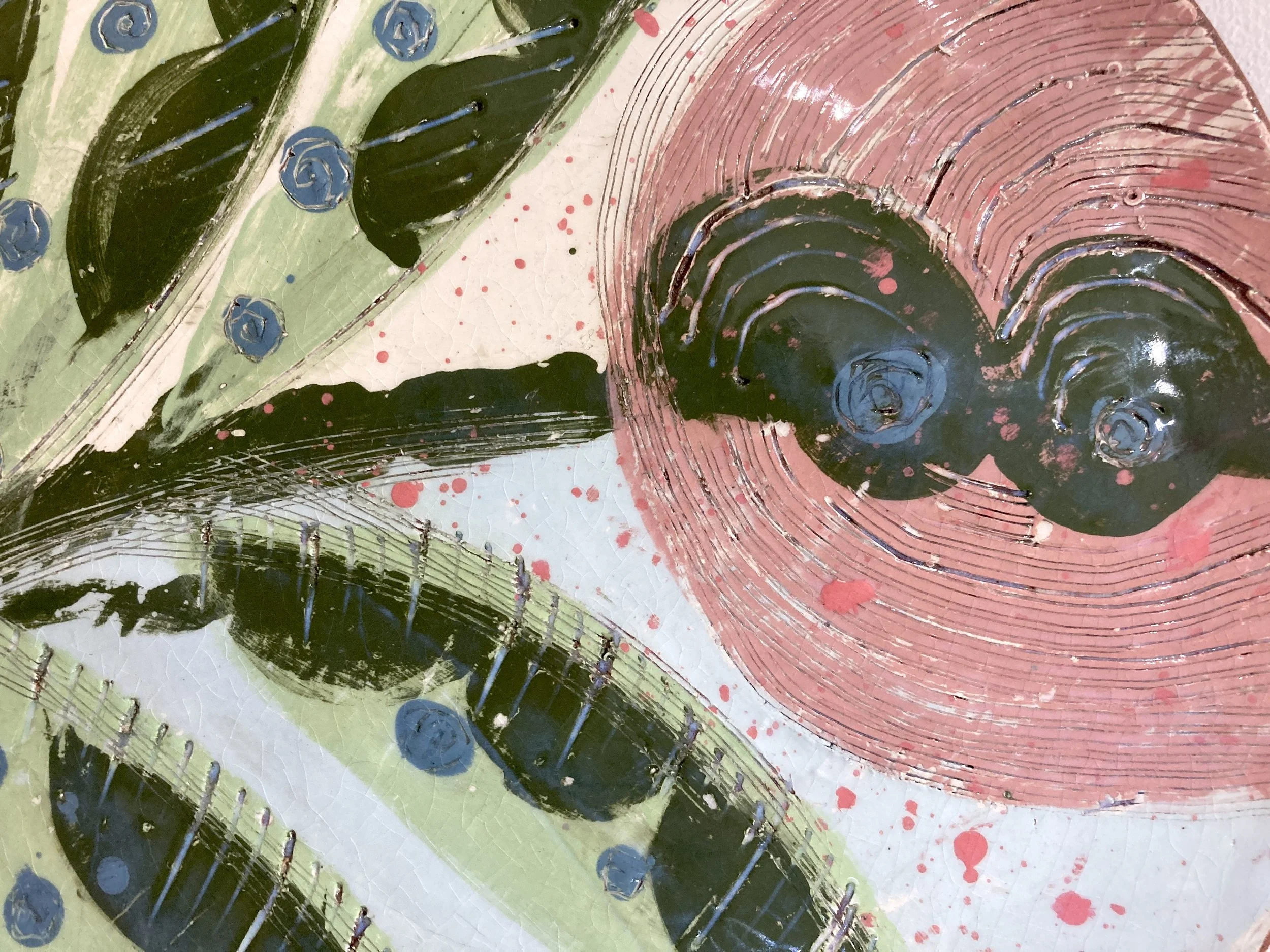 Detail of students monoprinting platter with slips