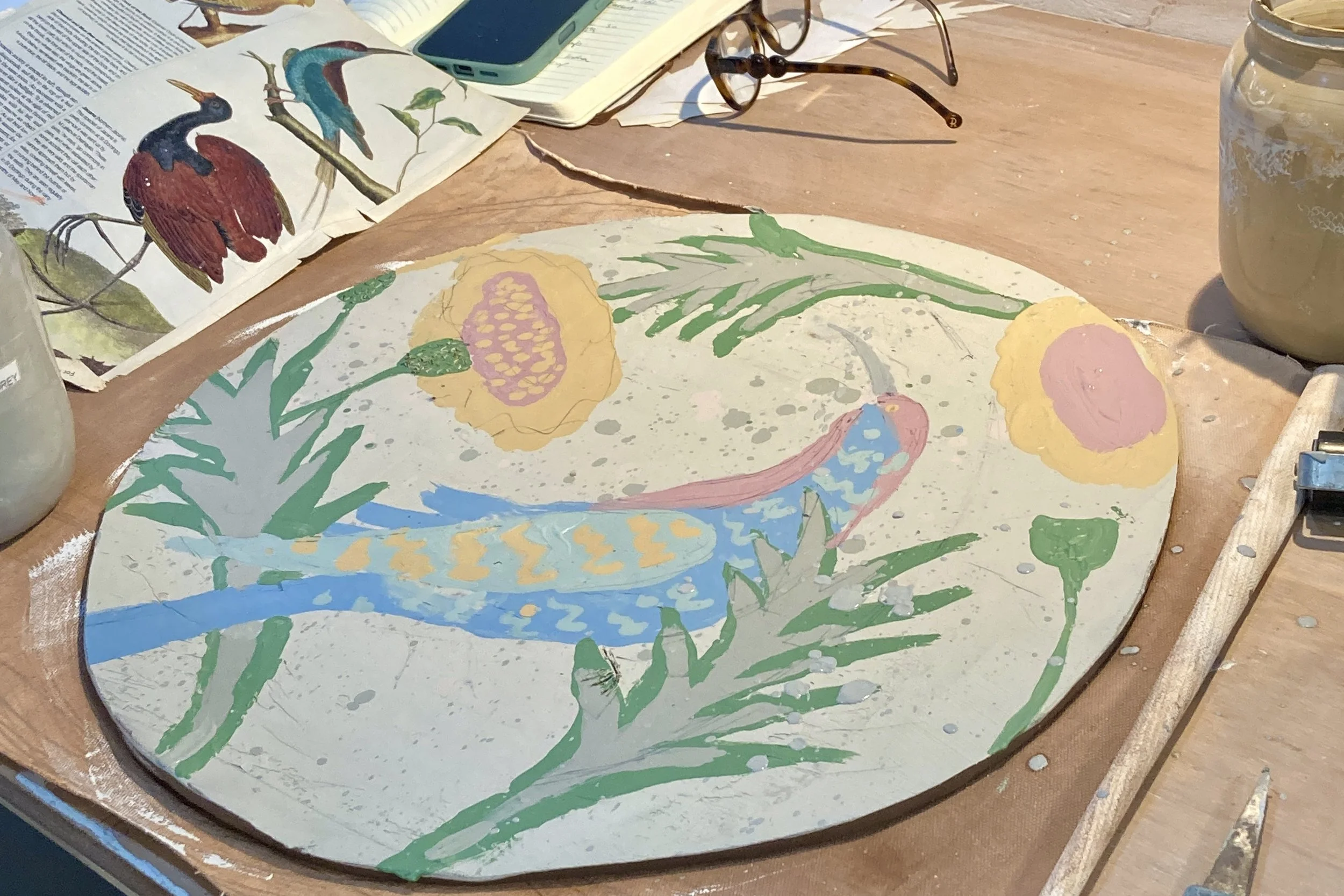 Freshly transferred slip monoprint onto clay in pottery studio Brigthon