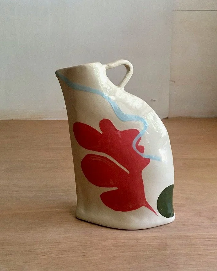 Unique hand-built clay vases with slip decoration